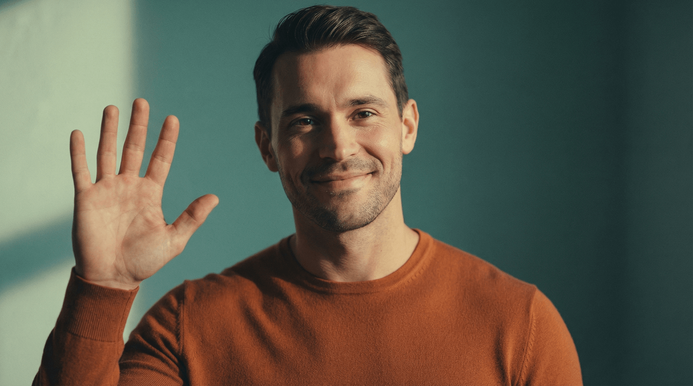 Smiling man raising his hand in a counseling session